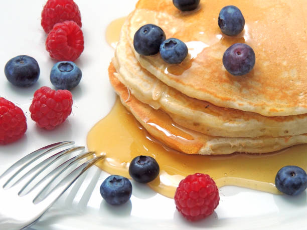 istock Fluffy pancakes with fresh berries and maple syrup 1191268164