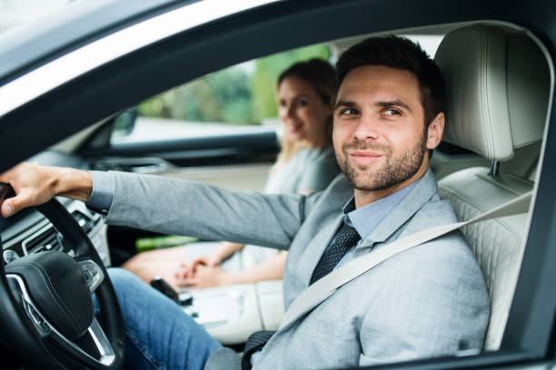 istock A young couple sitting in car, driving. 1191268522
