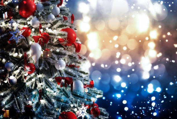 istock Christmas tree against a glittery luminous background 1191269377
