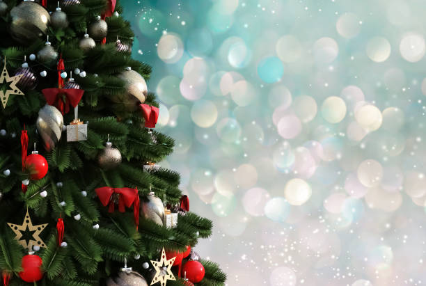 istock Christmas tree against a glittery luminous background 1191269403