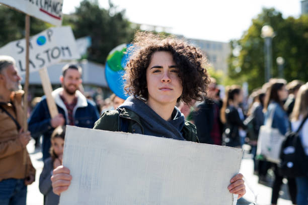 istock People with placards and posters on global strike for climate change. 1191271806