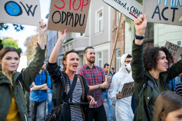 istock People with placards and posters on global strike for climate change. 1191271813