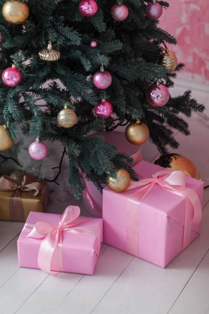 istock Christmas gift box near the Christmas tree. 1191271864