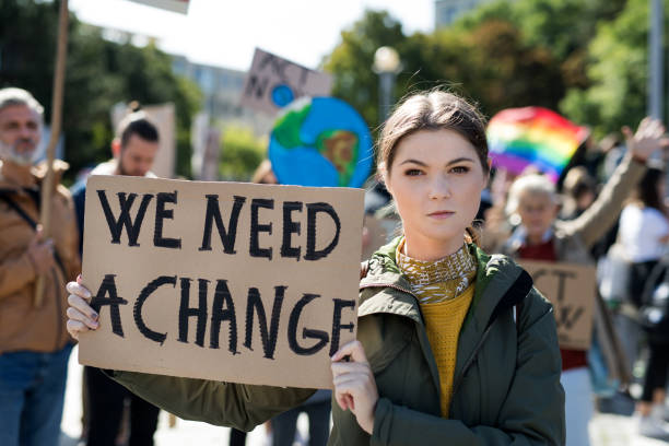 istock People with placards and posters on global strike for climate change. 1191271898