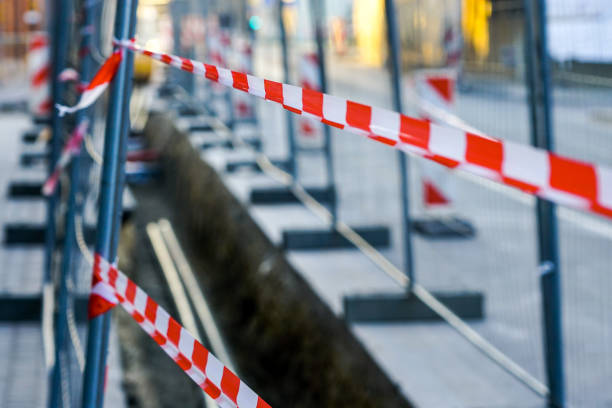 istock red and white striped warning tapes restrict access to the communications replacement trench 1191272002