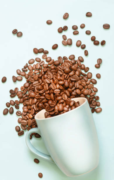 istock Cup full of coffee beans 1191272101