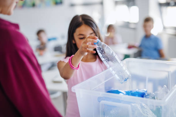 istock A teacher with small school kids in classroom learning about waste separation. 1191273862