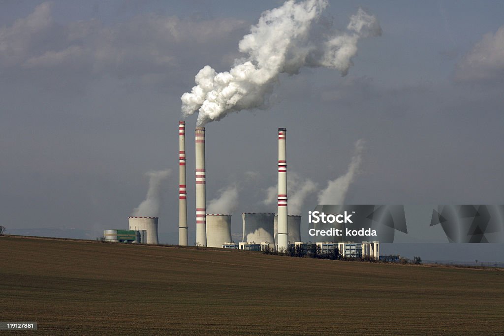 view of coal power plant over the field  Blue Stock Photo