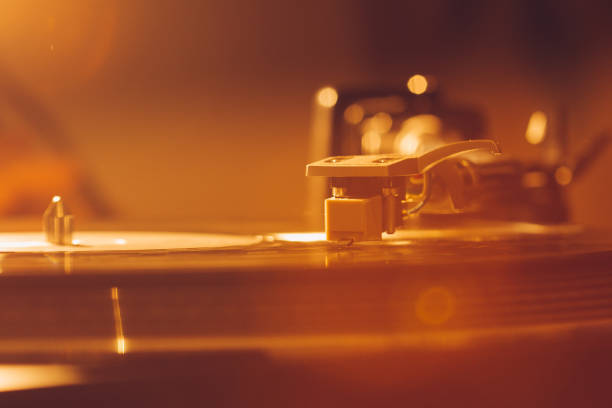 istock Close up of turntable needle on a vinyl record. Turntable playing vinyl. 1191279295