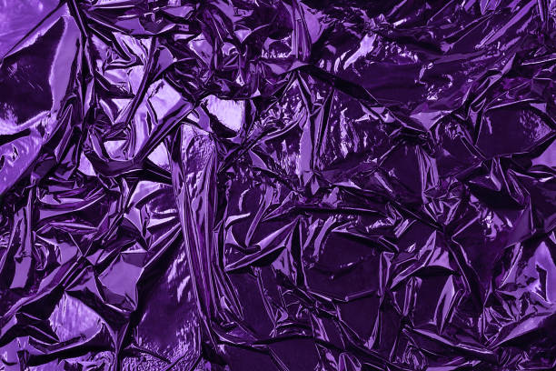 istock Shiny crumpled surface of violet foil for textured background. Backdrop for your design. 1191281395