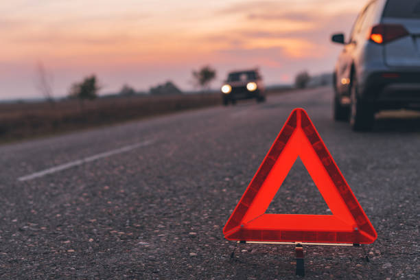 istock Warning triangle sign on the road in sunset 1191281447