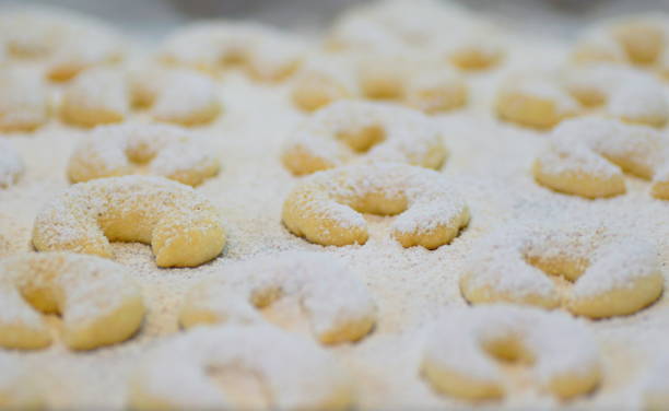 freshly baken vanilla crescents (vanillekipferl) covered with powdered sugar