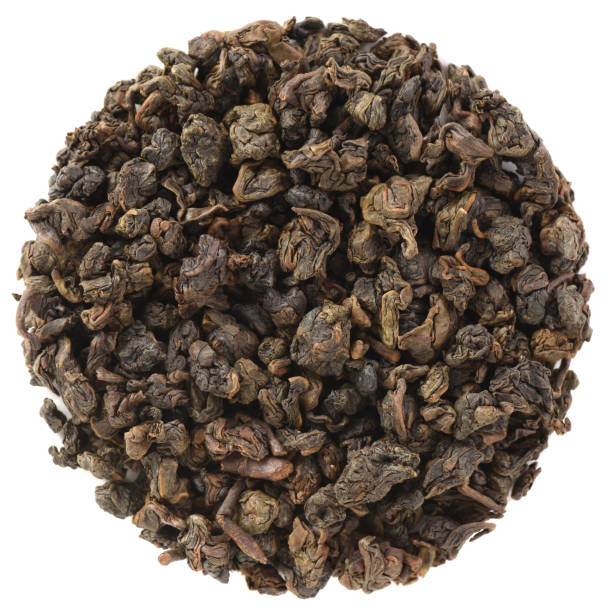 istock High grade dry leaf tea in round shape. Mingjian Organic Master Spring Charcoal Roasted Oolong Tea isolated on white background 1191284629