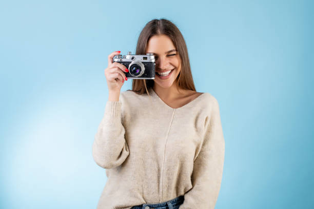 istock woman with vintage camera 1191285036