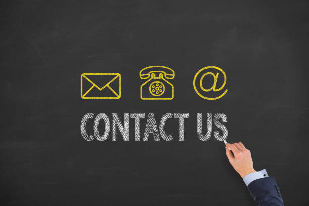 istock Human Hand Drawing Contact Us on Blackboard 1191285384