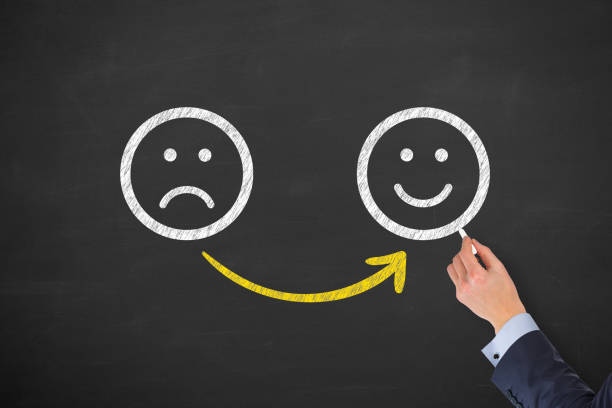 istock Hand Drawing Unhappy and Happy on Blackboard 1191287158