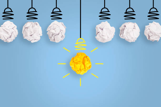 istock Creative Idea Concepts Light Bulb Crumpled Paper on Blue Background 1191287198