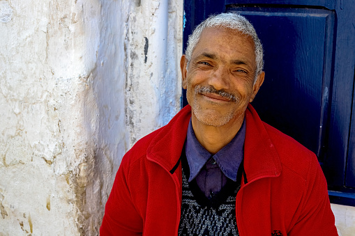 Rabat, Morocco - 22.04,2019: Moroccan man, an elderly seller in the market - portrait