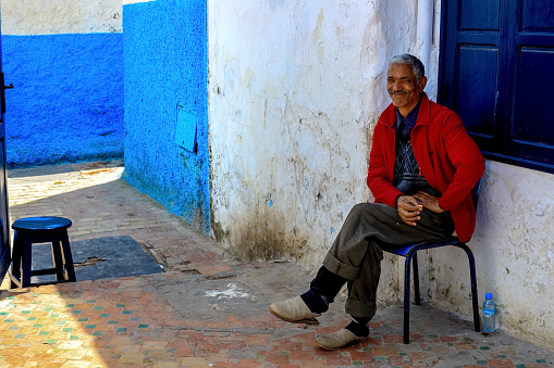 Rabat, Morocco - 22.04,2019: Moroccan man, an elderly seller in the market - portrait