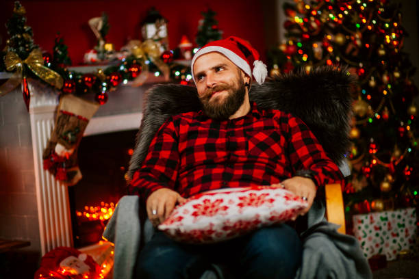 istock Handsome Young Man wearing Santa's Hat. Christmas Guy Portrait 1191293481