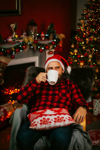 istock Handsome Young Man wearing Santa's Hat. Christmas Guy Portrait 1191293483