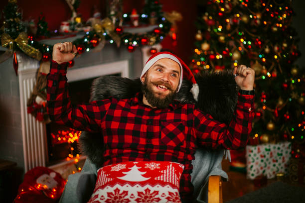 istock Handsome Young Man wearing Santa's Hat. Christmas Guy Portrait 1191293532