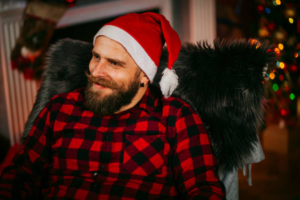 istock Handsome Young Man wearing Santa's Hat. Christmas Guy Portrait 1191293534