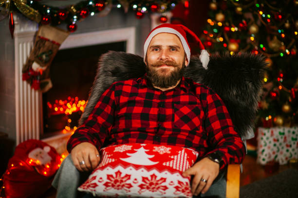 istock Handsome Young Man wearing Santa's Hat. Christmas Guy Portrait 1191293570