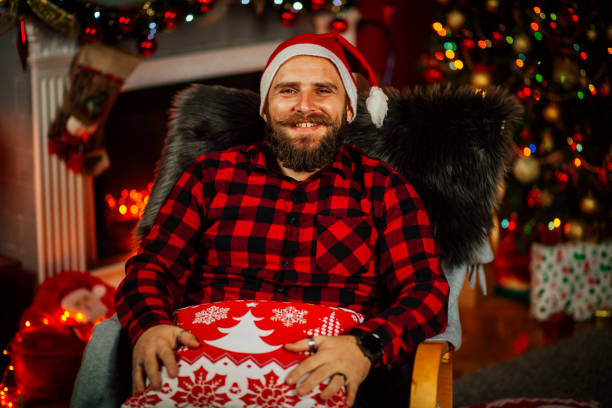 istock Handsome Young Man wearing Santa's Hat. Christmas Guy Portrait 1191293592