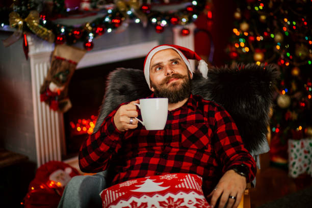 istock Handsome Young Man wearing Santa's Hat. Christmas Guy Portrait 1191293631