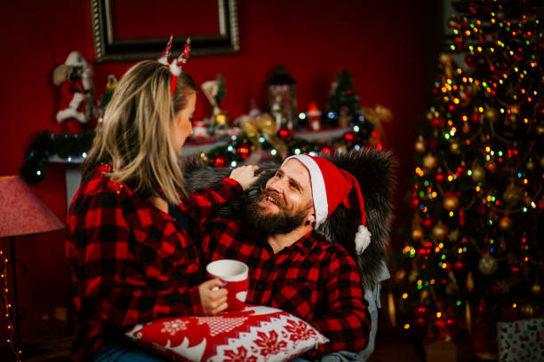 istock Young Couple Having A fun At Home For Christmas 1191293929