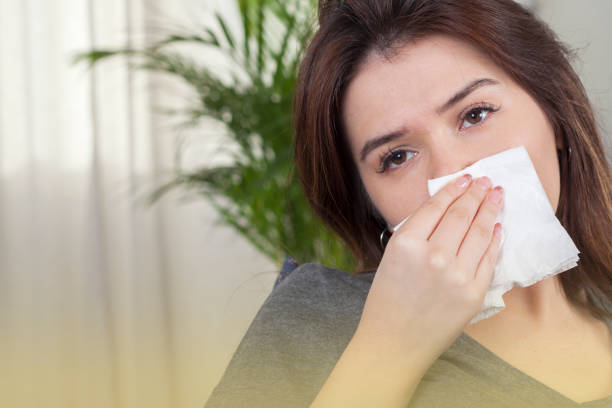 istock woman got illness and blowing nose 1191299435