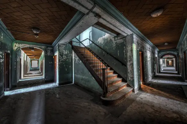 Photo of Staircase in Hallway of Abandoned Hospital