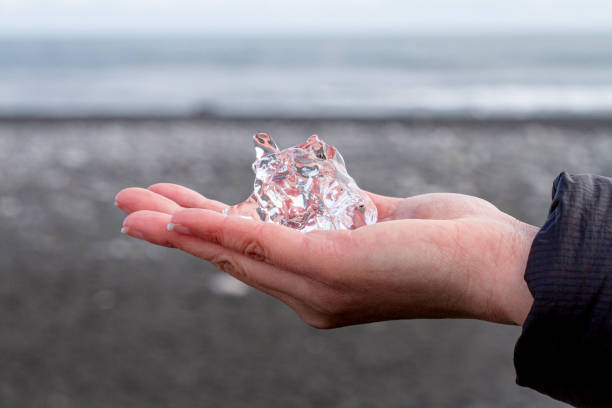 Ice in hand stock photo