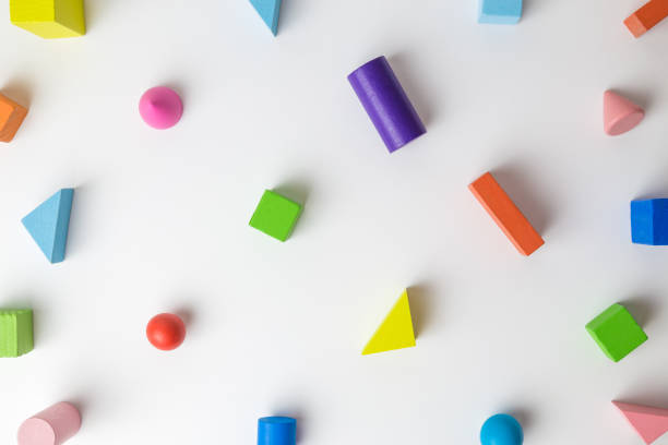 istock Colorful 3D wooden geometric shapes pattern on white background minimal creative concept. 1191309705