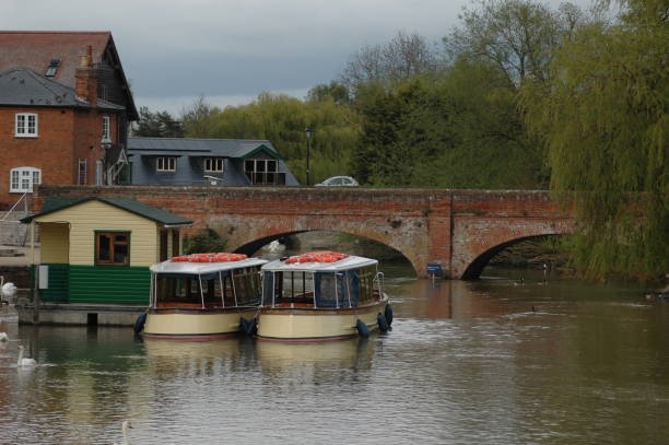 istock boats under bridge at stratford upon avon 1191310511
