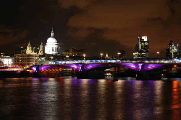 istock night skyline by the river thames in london, england 1191310603