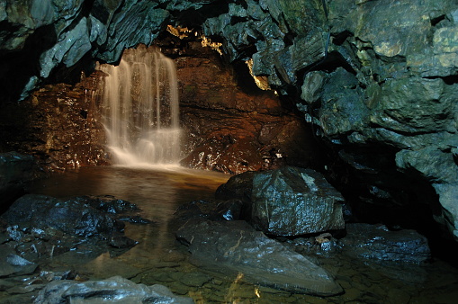 cascade inside ingleborough cave in yorkshire, england