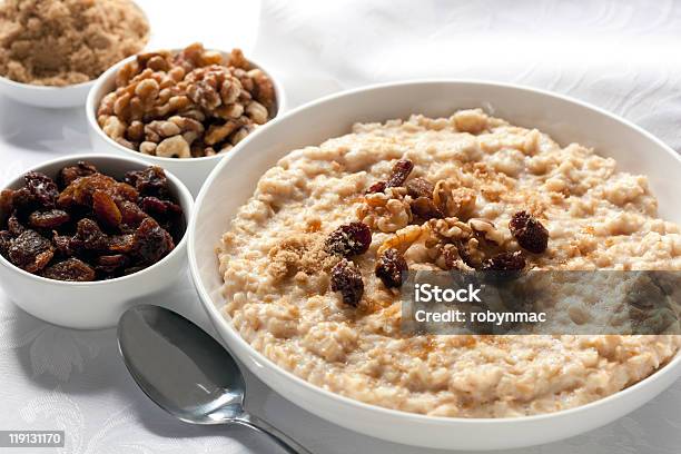Bowls Of Oatmeal Sitting On White Detailed Tablecloth Stock Photo - Download Image Now
