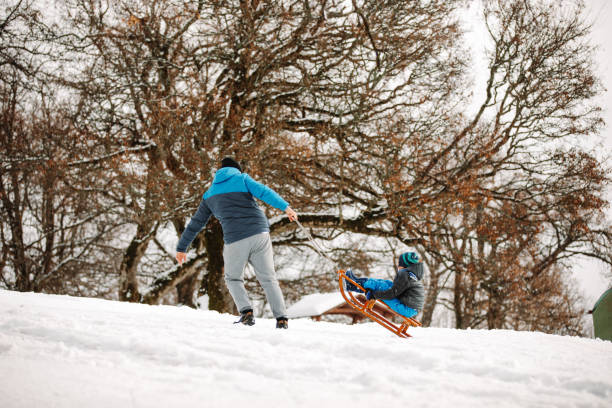 istock Sledding on the snowy mountain 1191314106