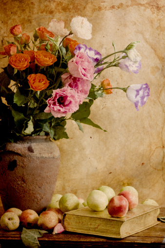 An ancient still-life with colours in brown tones.