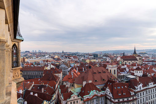 Aerial view of citycape of old town of Prague, with a lot of red rooftops and churches