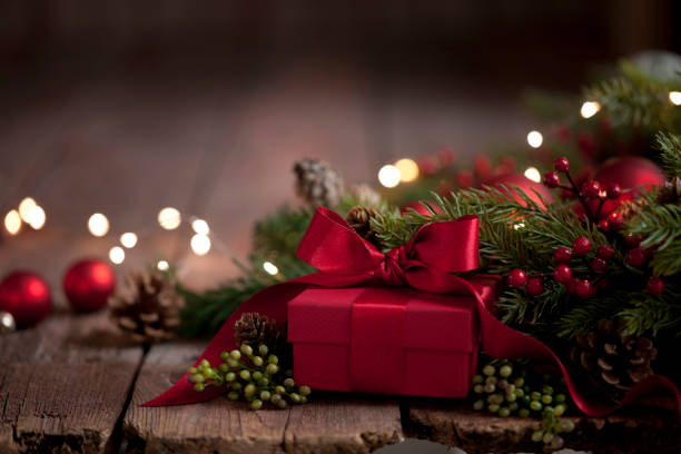 istock Christmas Gift on Old Wood Background 1191319566