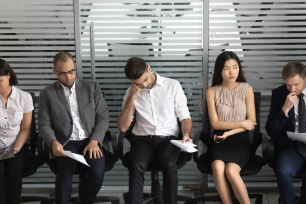 istock Diverse candidates waiting for job interview, people sitting in row 1191319893