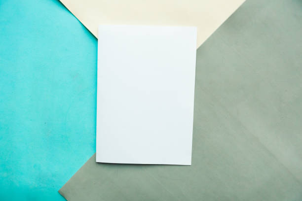 white mockup blank on geometric blue, gray and white pastel background - paper sheet imagens e fotografias de stock