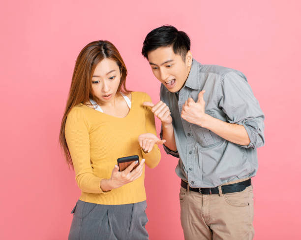 istock Shocked young couple watching the  smart phone 1191322650
