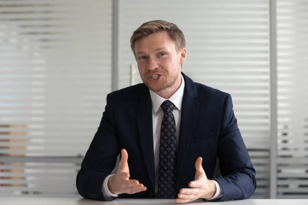 istock Portrait businessman coach looking at camera, talking, making video call 1191327287