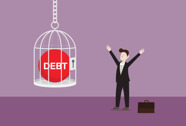 istock Businessman with a red debt ball in the cage 1191329114