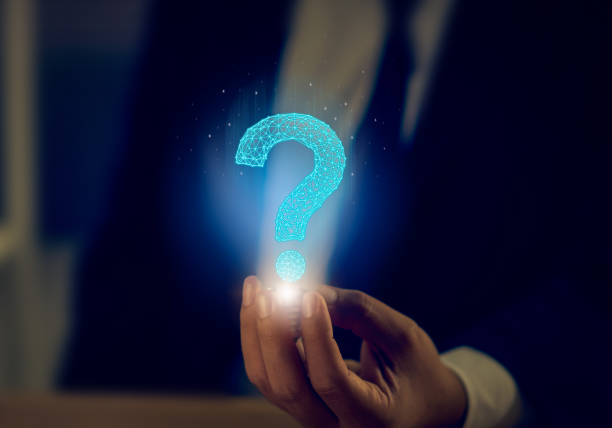 istock Businessman holding abstract icon question mark, ask symbol, help support on the table. 1191330350