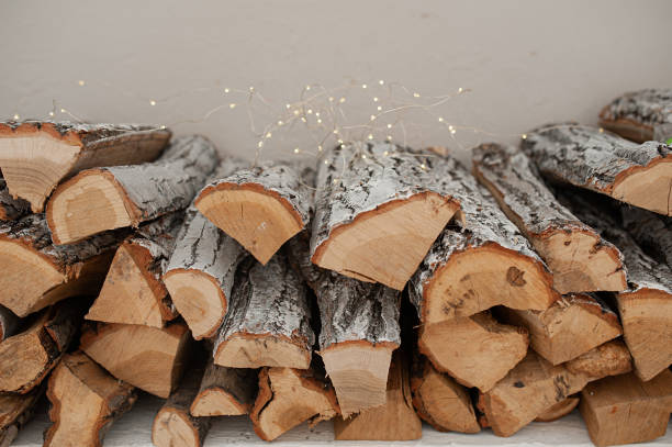 istock stack of logs stacked evenly stacked, with a garland, in a bright room 1191339533